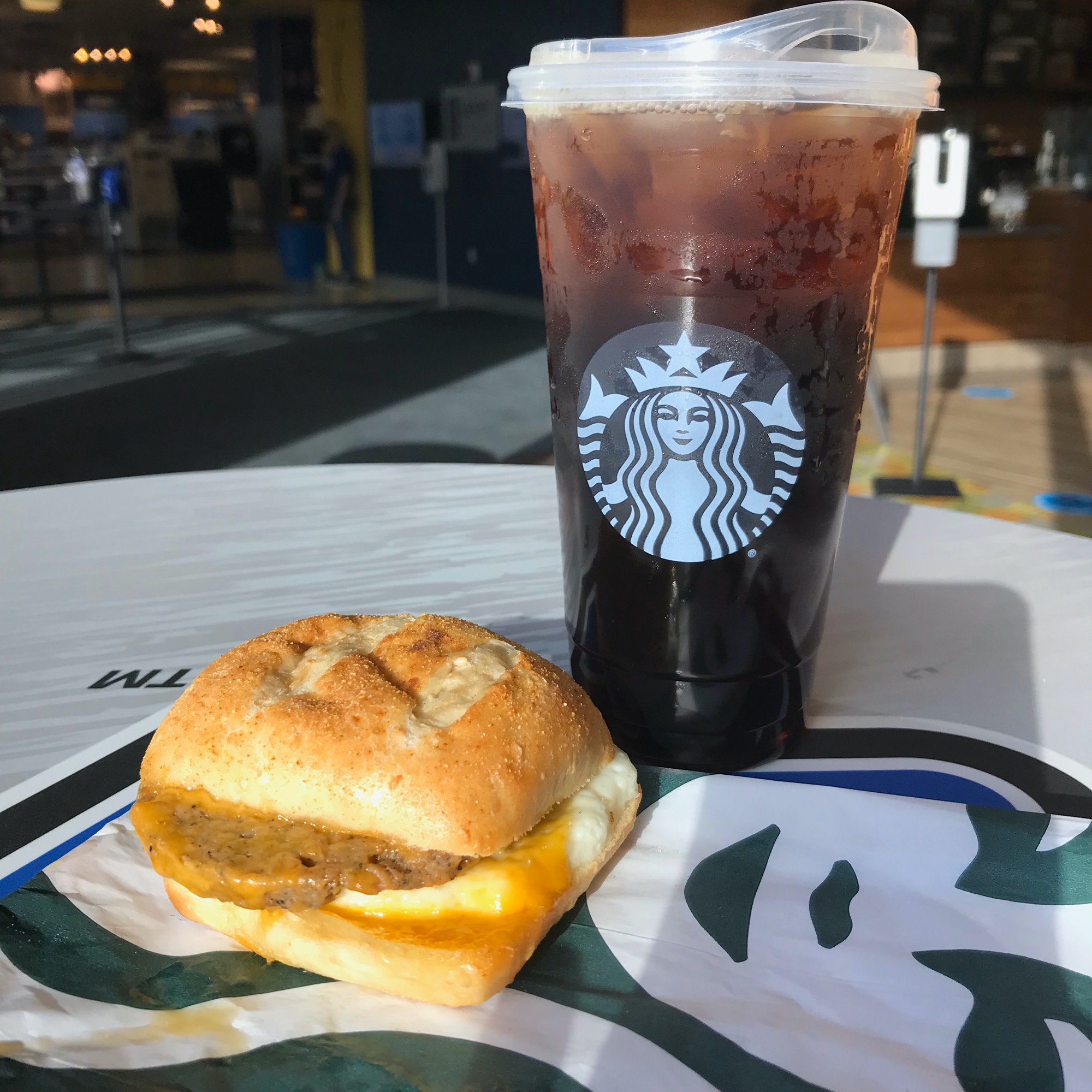 The Impossible Breakfast Sandwich with an iced black coffee.